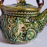 Set of old teapots and honey pot