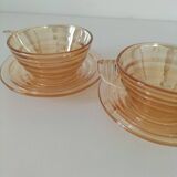 Iridescent cups and saucers