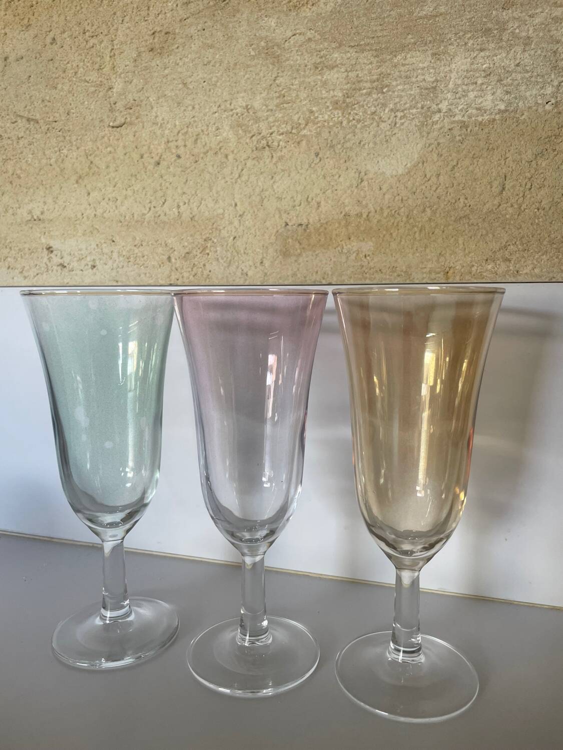3 iridescent colored champagne glasses