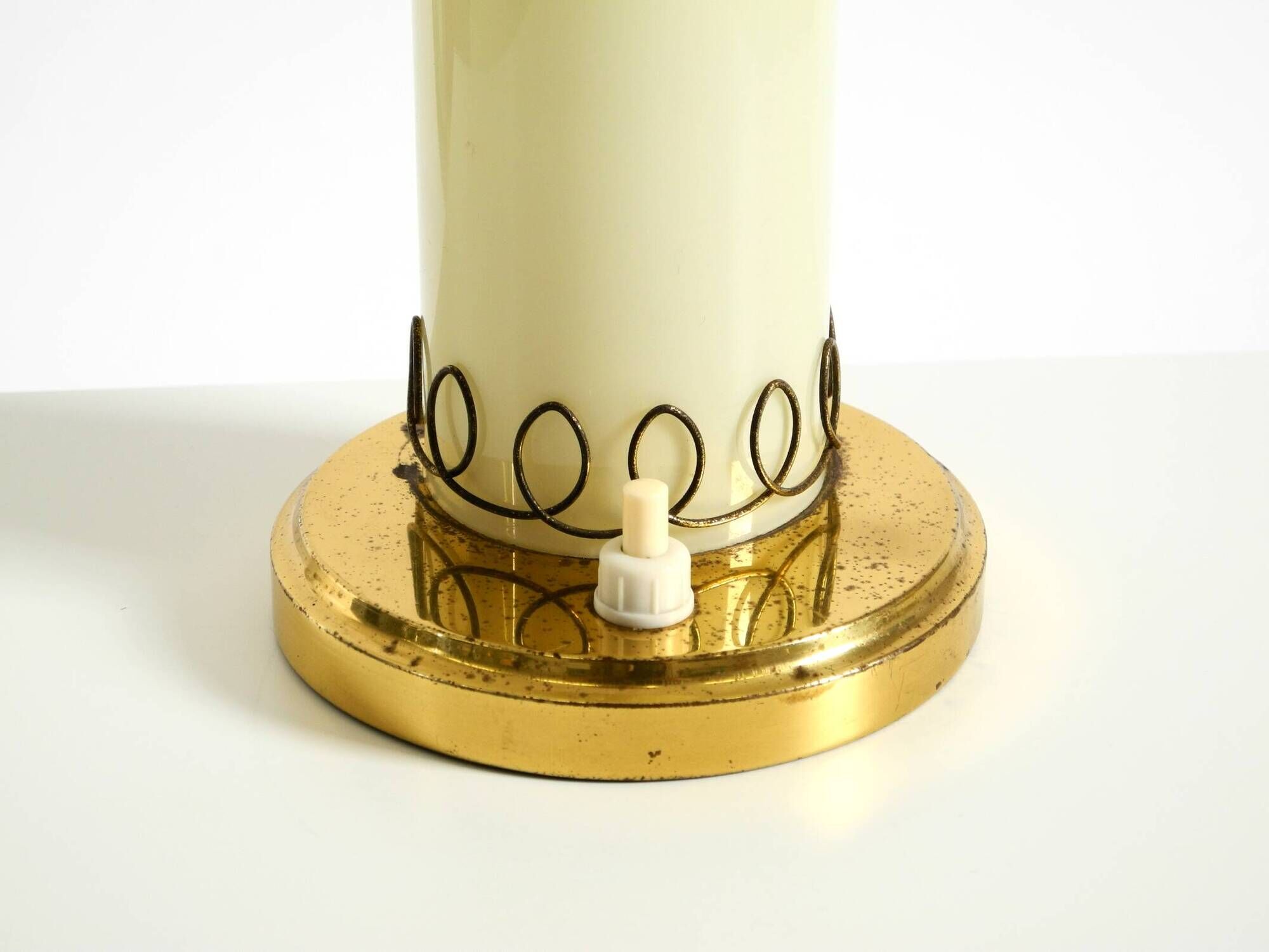A beautiful, rare 1950s brass table lamp with one opal glass shade adorned