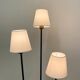Three-light floor lamp in black lacquered metal, circa 1950.