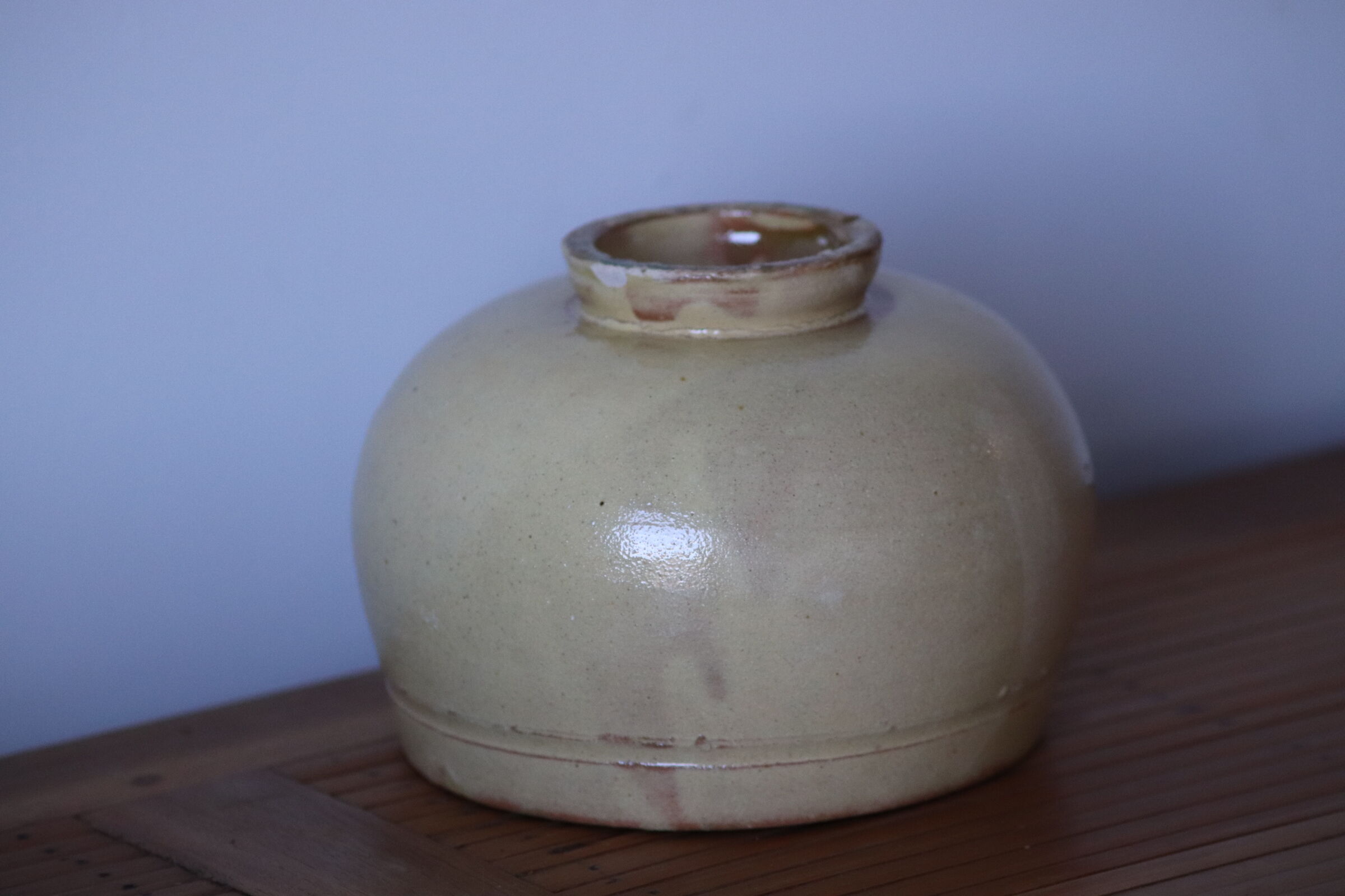 Ball vase in pale yellow glazed sandstone