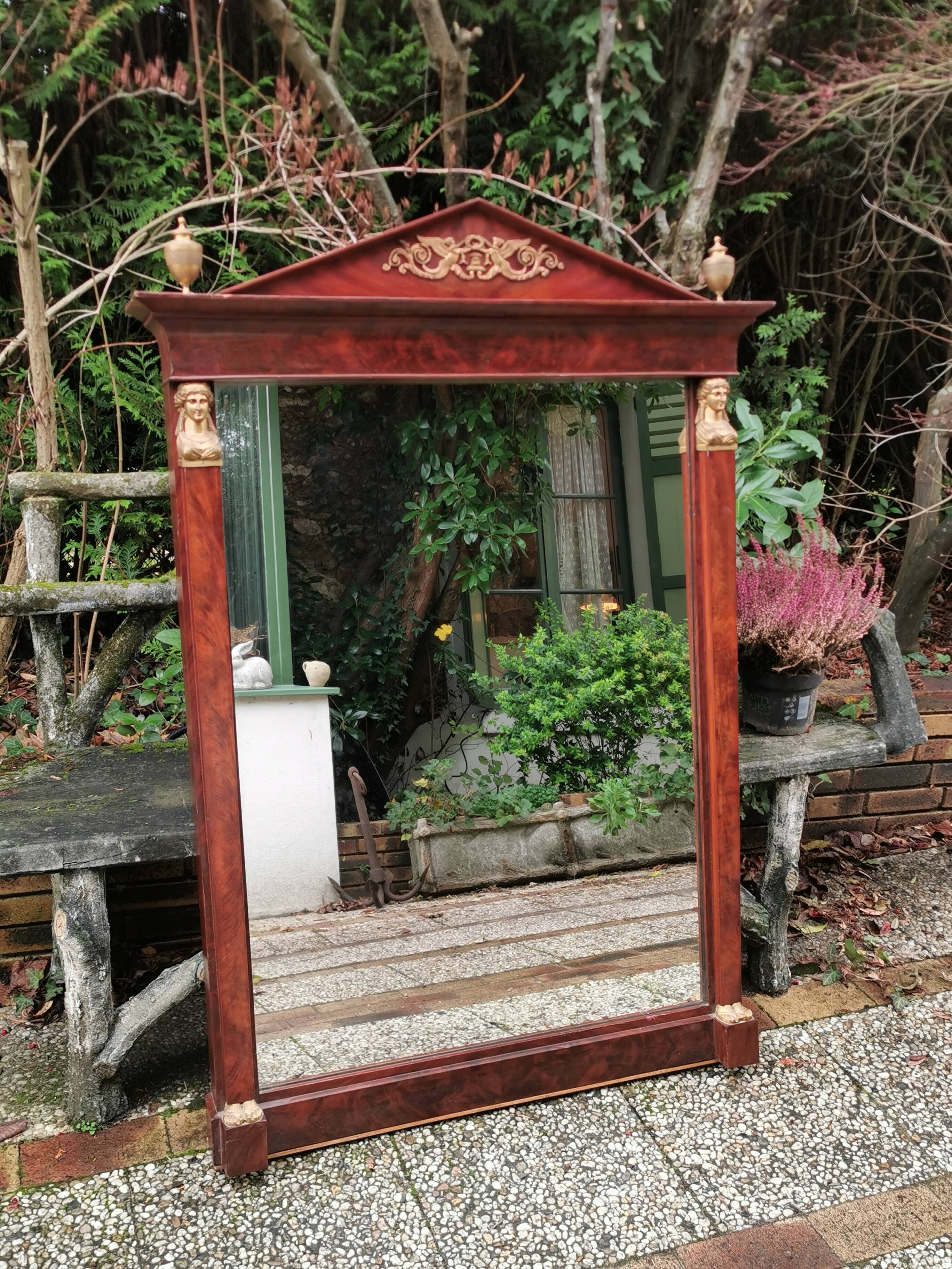 Mahogany pediment mirror with Empire-style cariatids. Return from Egypt