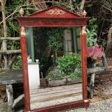 Mahogany pediment mirror with Empire-style cariatids. Return from Egypt