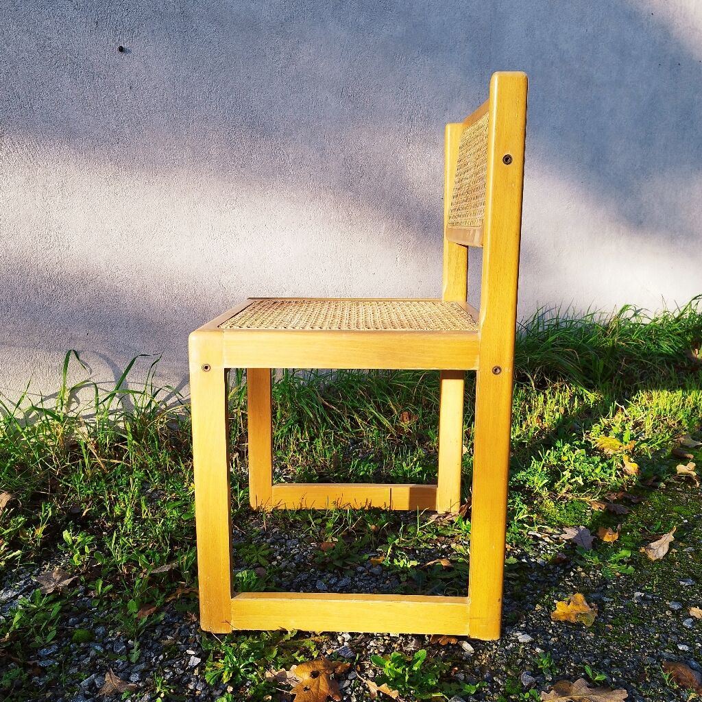 Four trendy tanned wooden chairs