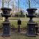 Large antique cast iron planters on pedestal jardiniere