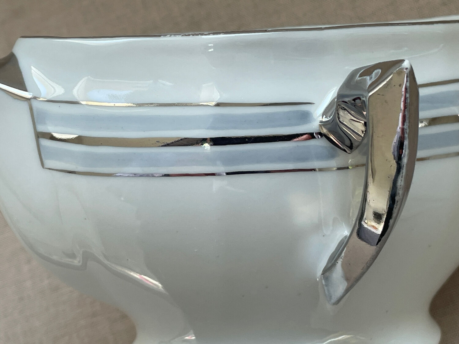 Antique white French porcelain sauce boat M&S with silver trim.