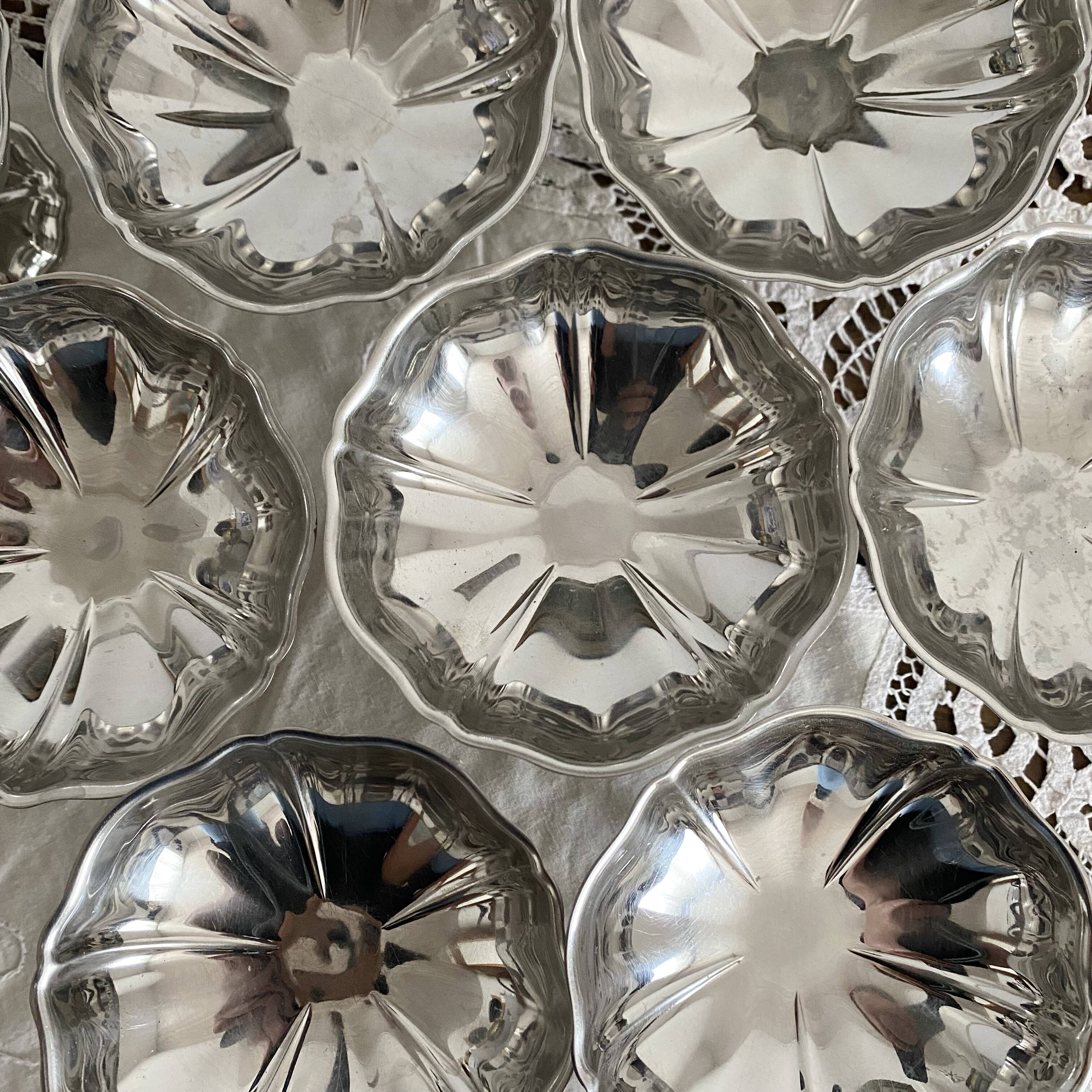 Vintage stainless steel cups on foot