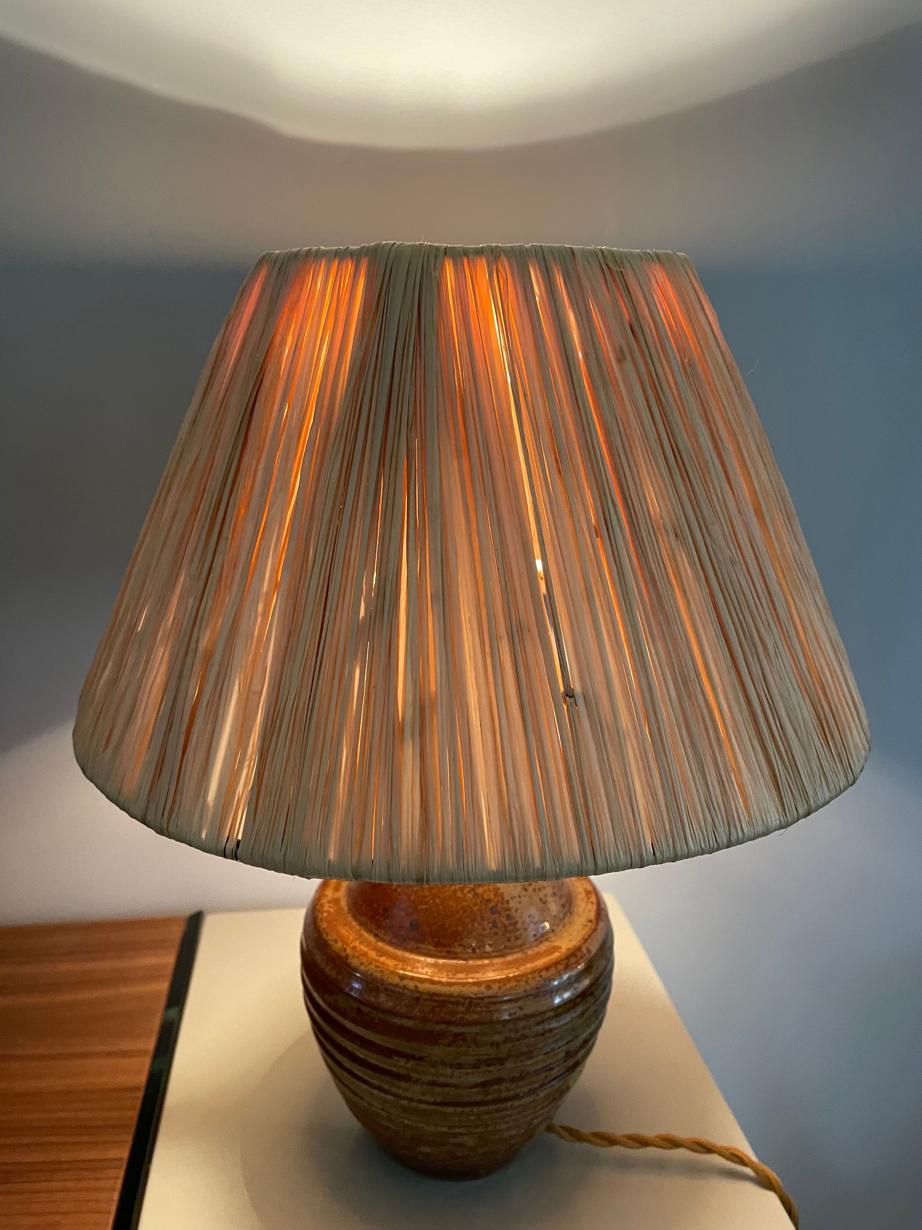 Sandstone lamp and raffia