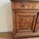 Antique walnut sideboard from the period.