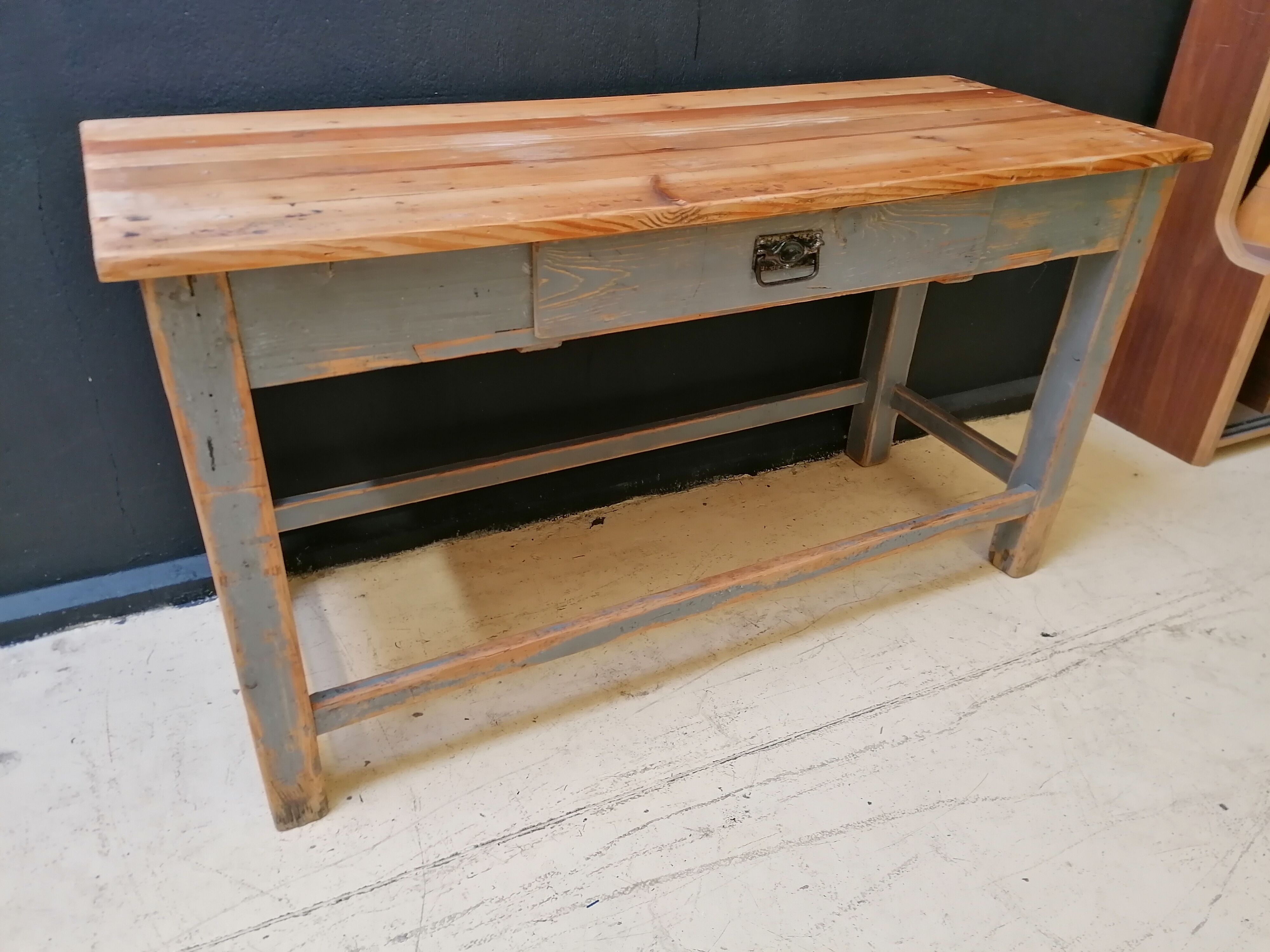 Patinated drapery table