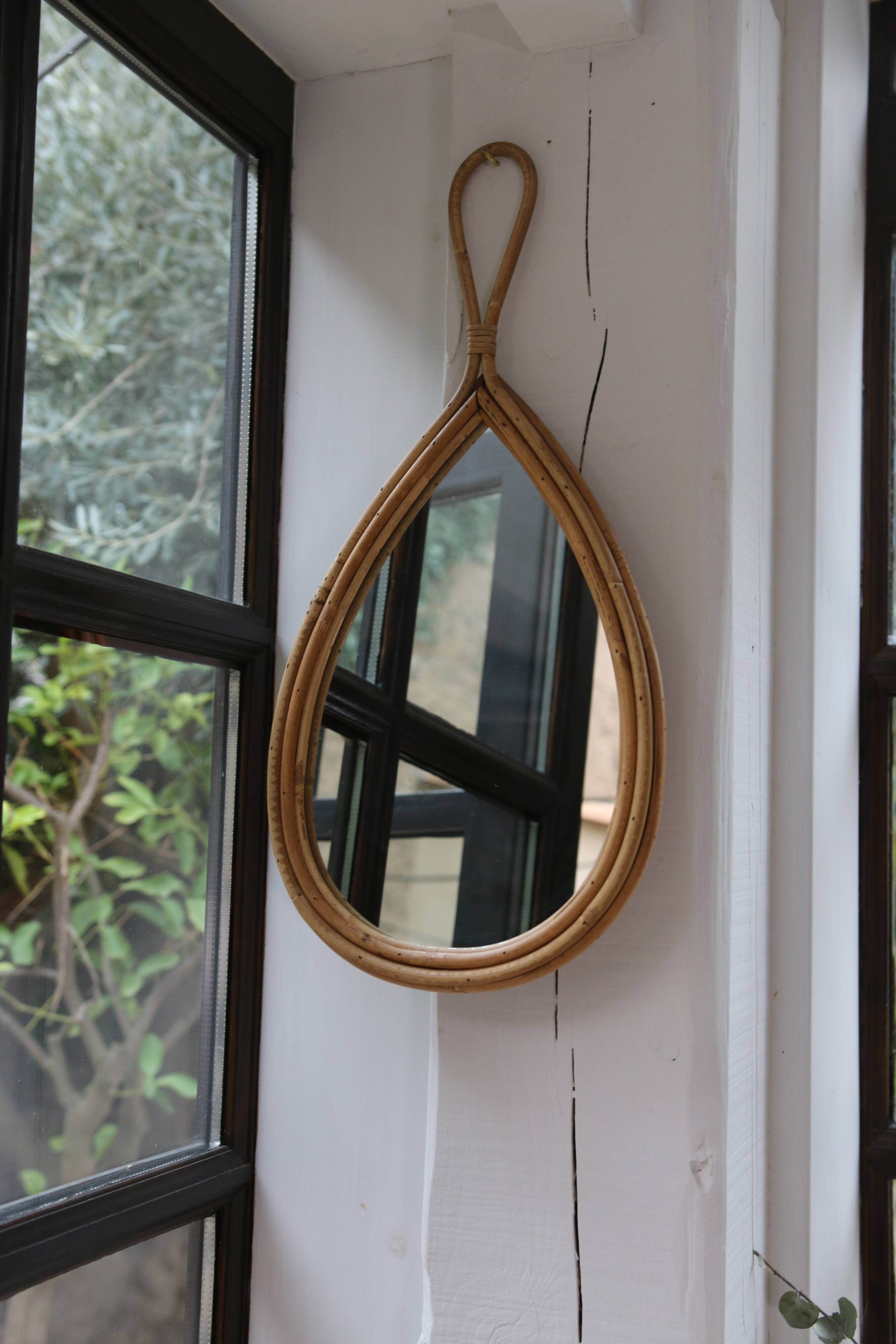 Vintage teardrop rattan mirror