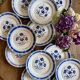 Set of 12 antique flat plates, blue flower decorations