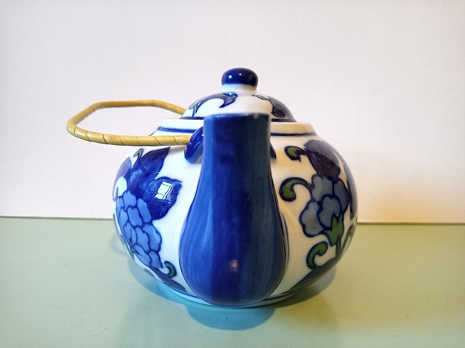 Hand-painted blue floral pattern teapot