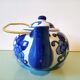 Hand-painted blue floral pattern teapot