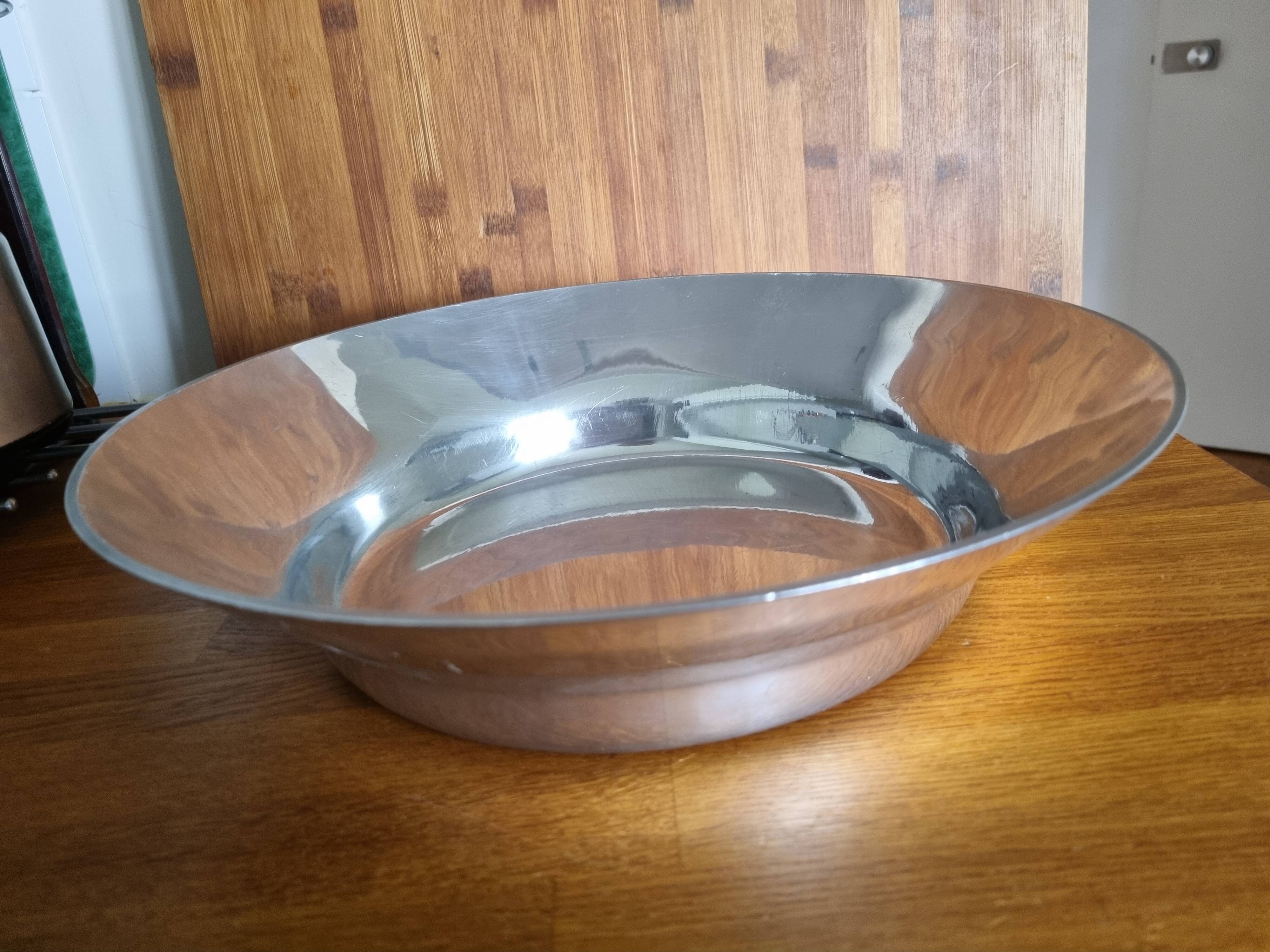 Large round hollow metal dish