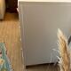 Restored wooden art deco chest of drawers with gilded handles