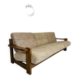 Old 3-seater sofa in solid wood, Maison Regain design, from the 70s.
