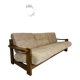 Old 3-seater sofa in solid wood, Maison Regain design, from the 70s.