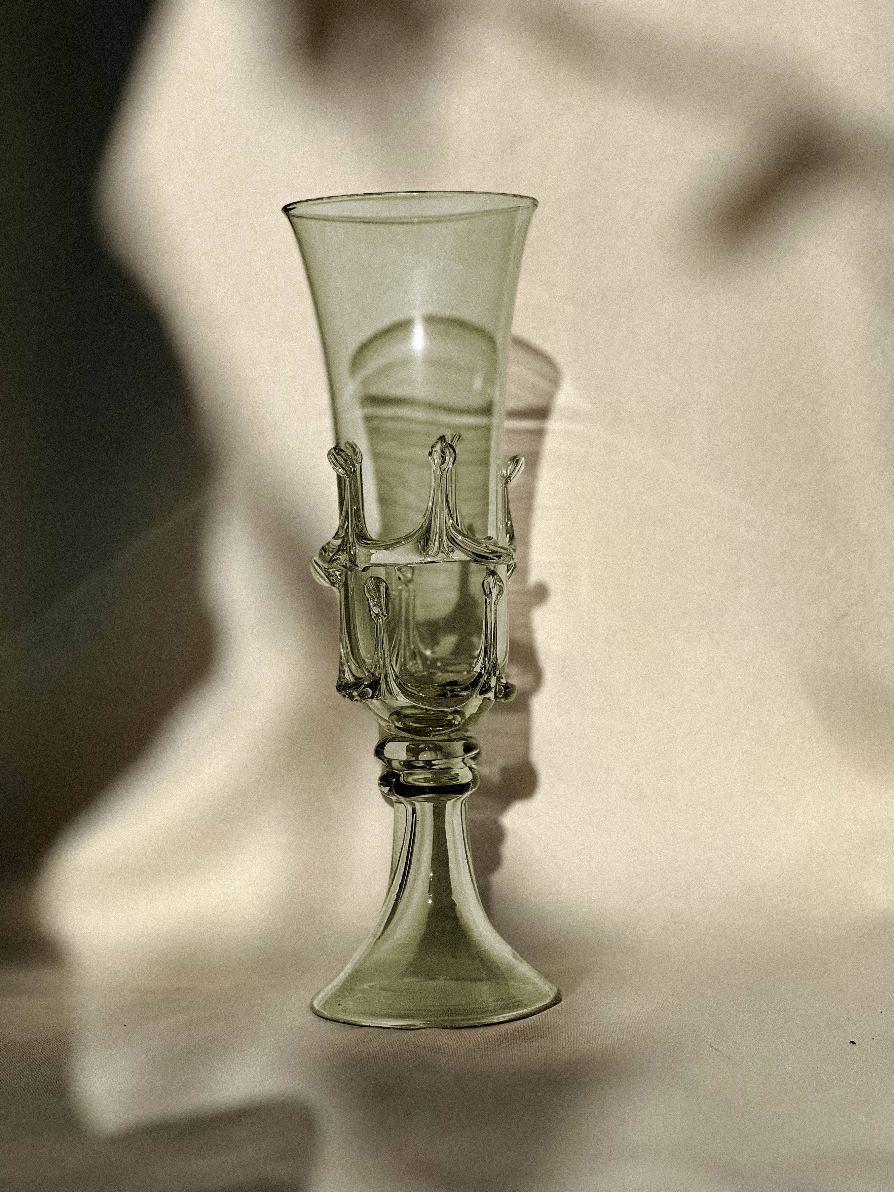 pair of green glass champagne flutes - label