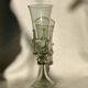 pair of green glass champagne flutes - label