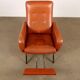 Vintage armchair from the 1970s in foam, faux leather, and metal.
