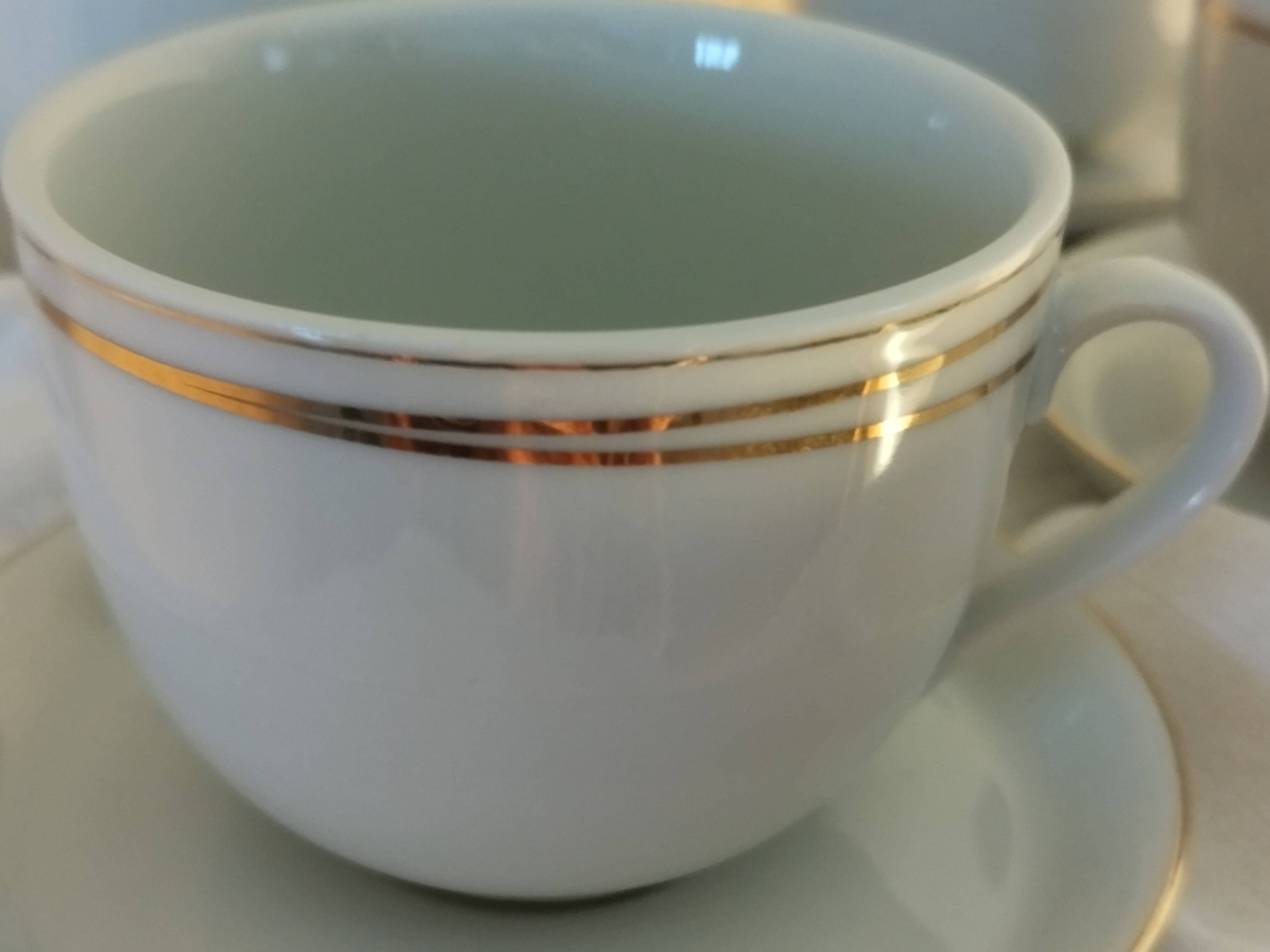 Set of 4 white and gold porcelain cups
