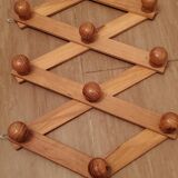 Accordion wall coat rack