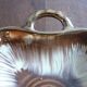Square dish with brown and gold handles