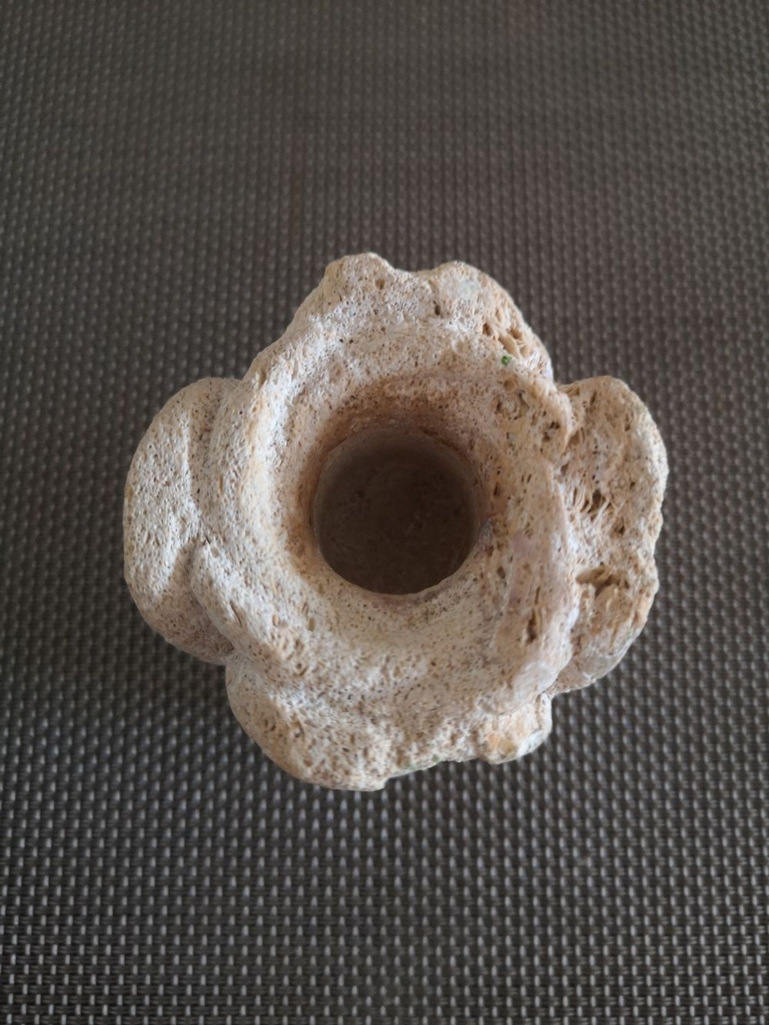 Candlestick in carved stone, signed
