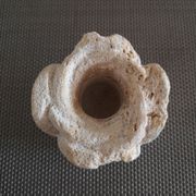 Candlestick in carved stone, signed