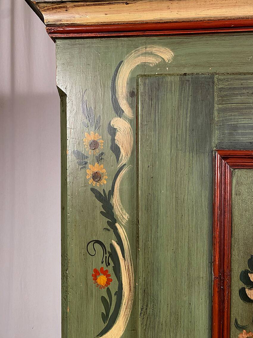 Alsatian bonnet maker in painted softwood with floral decorations