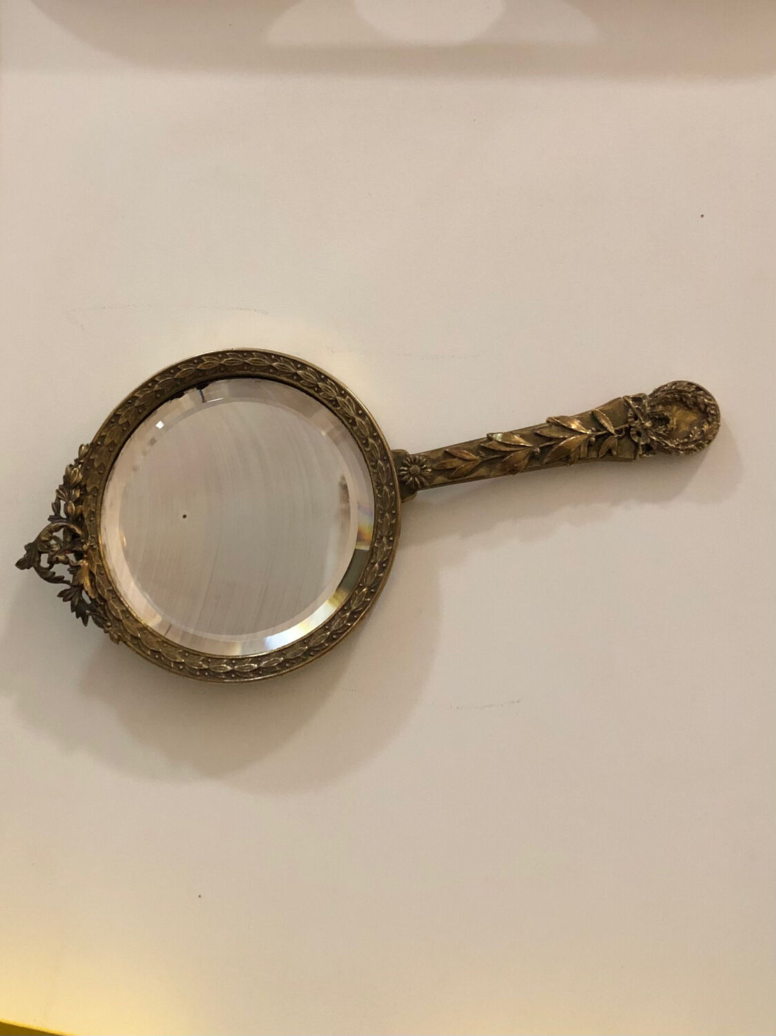 Hand mirror in gilded bronze