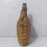 old bottle dressed in rattan vintage pilgrim gourd