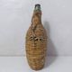 old bottle dressed in rattan vintage pilgrim gourd