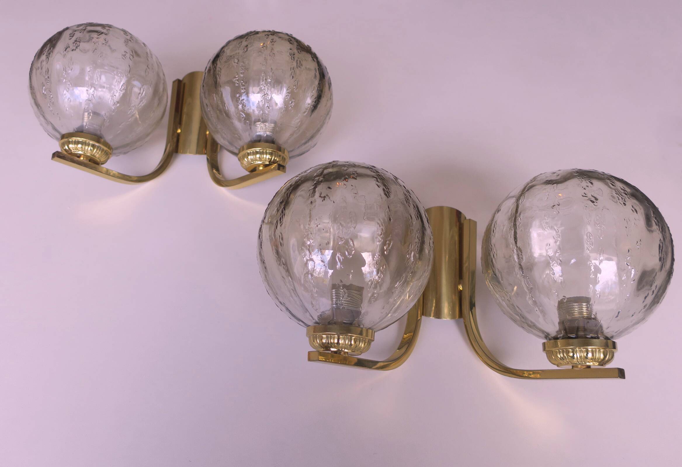 Mid century pair of brass and glass double wall lights, 1970s