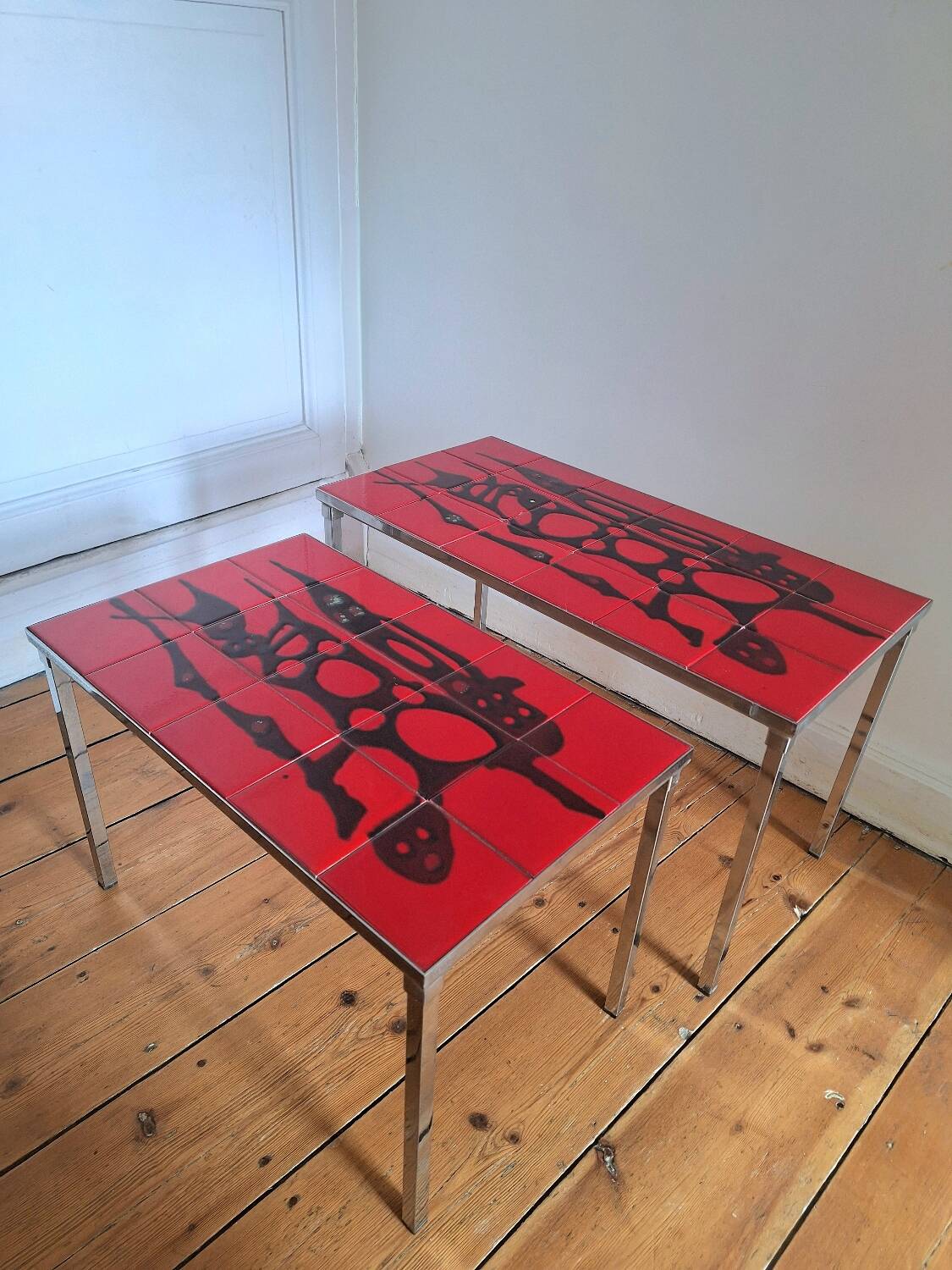Pair of nesting coffee tables, vintage ceramic furniture.