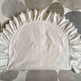 Two half-moon ruffled cushion covers
