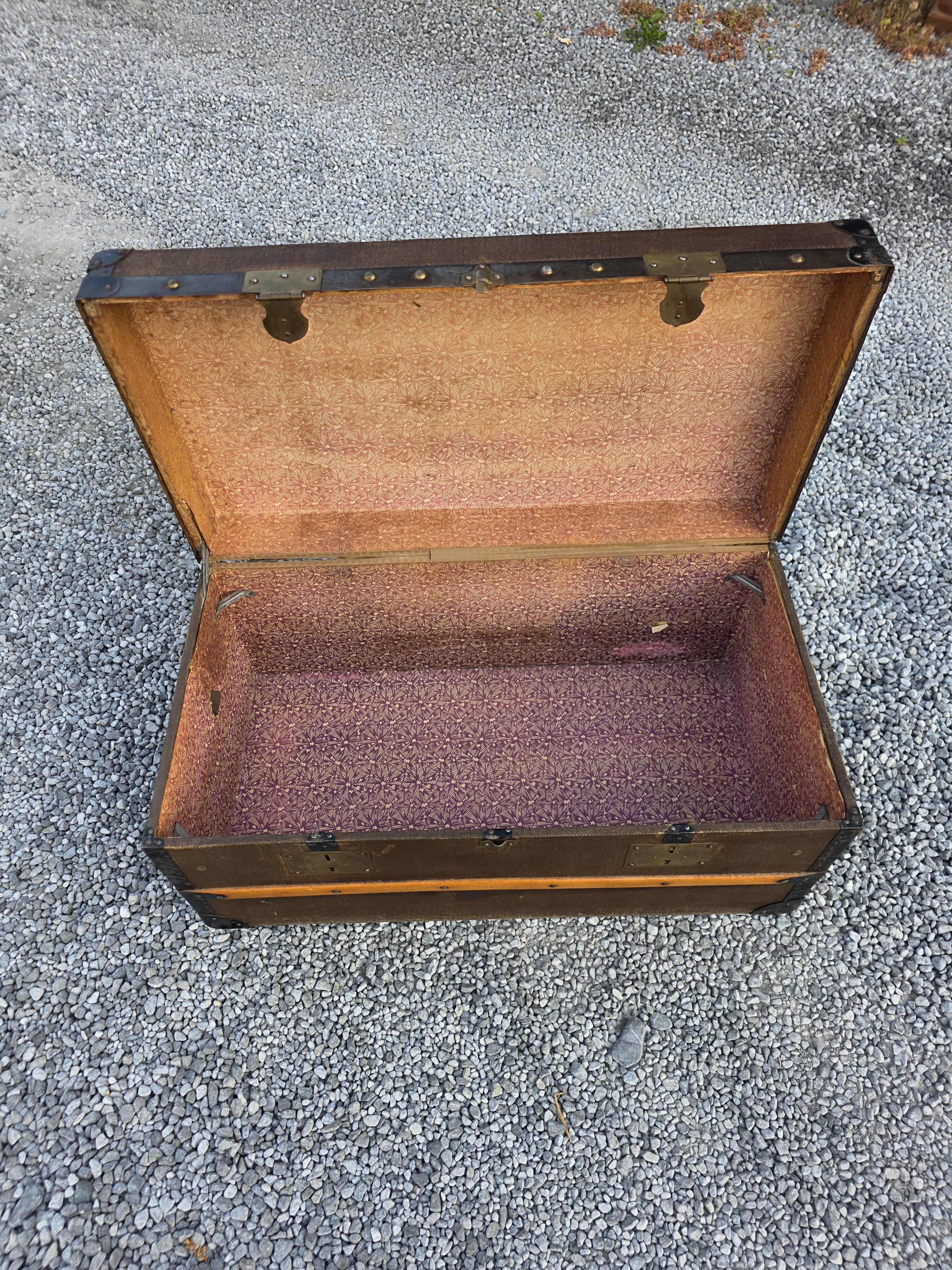 Old travel trunk in oilcloth