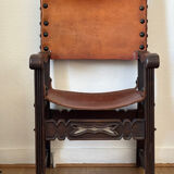 Frailero armchair, antique Spanish — carved wood & full-grain leather.