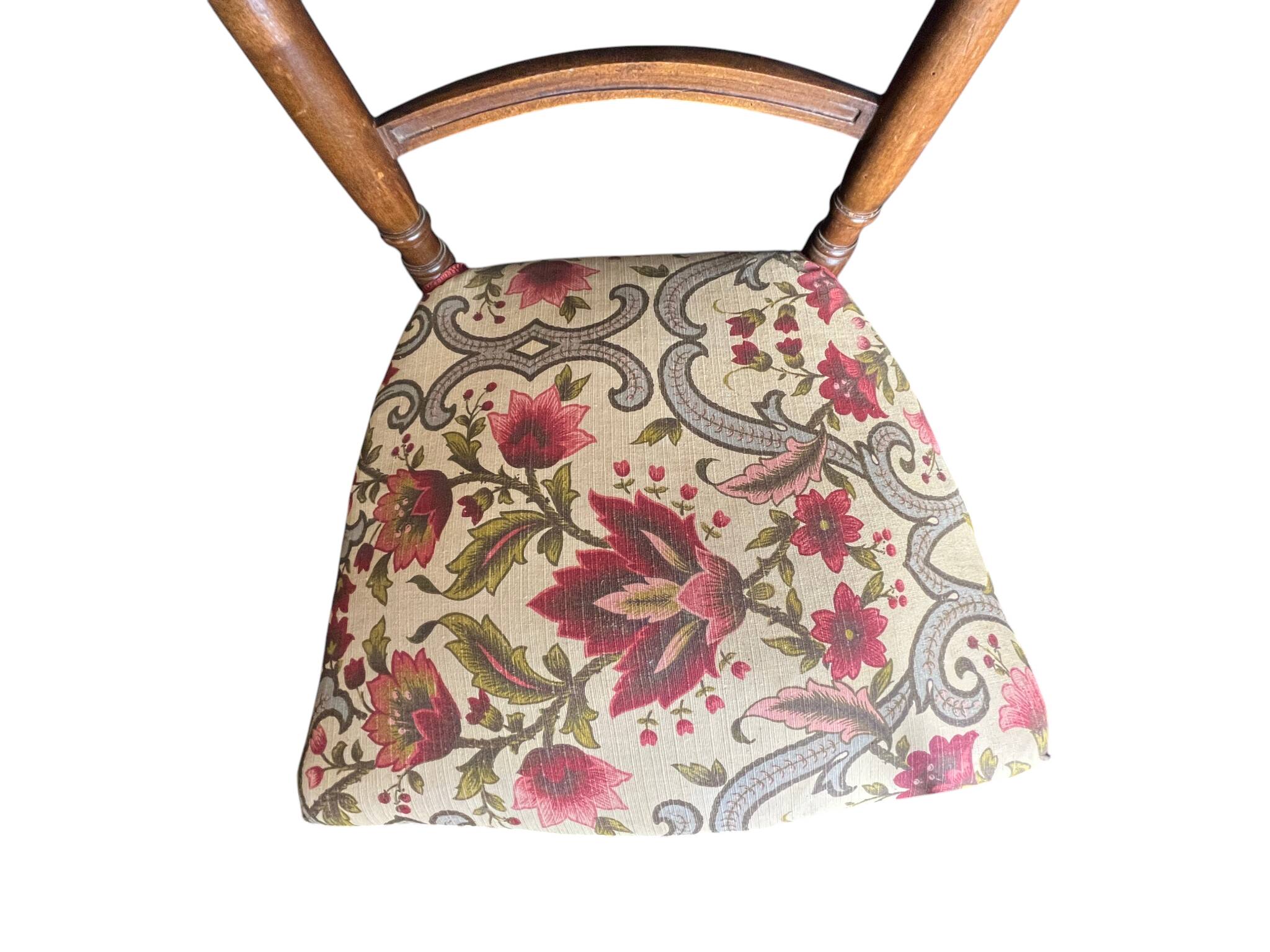 Two floral upholstered music chairs from the early 20th century.