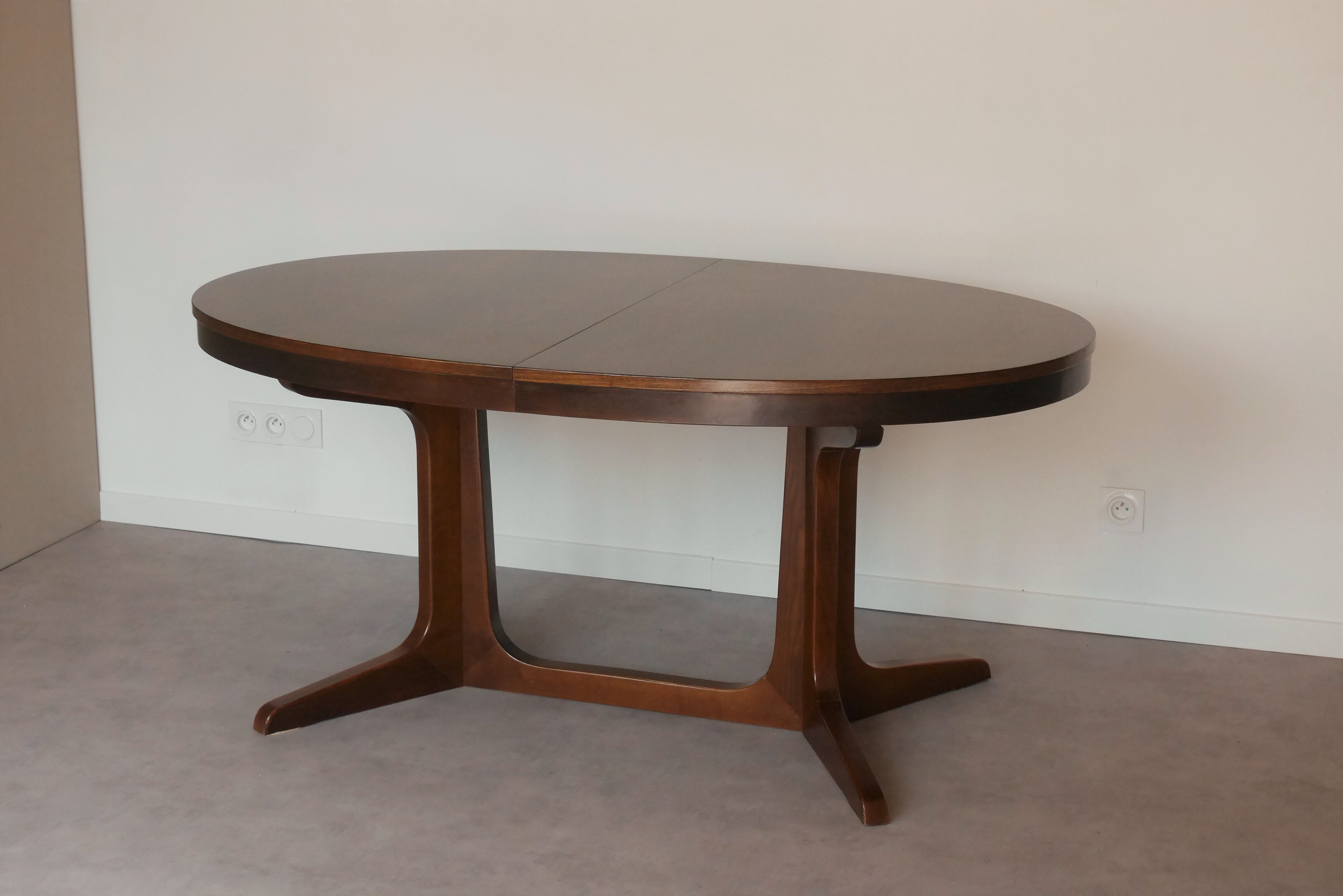 Scandinavian style oval table in central foot with extensions