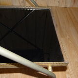 Rolling dessert in gold metal and trays in black formica