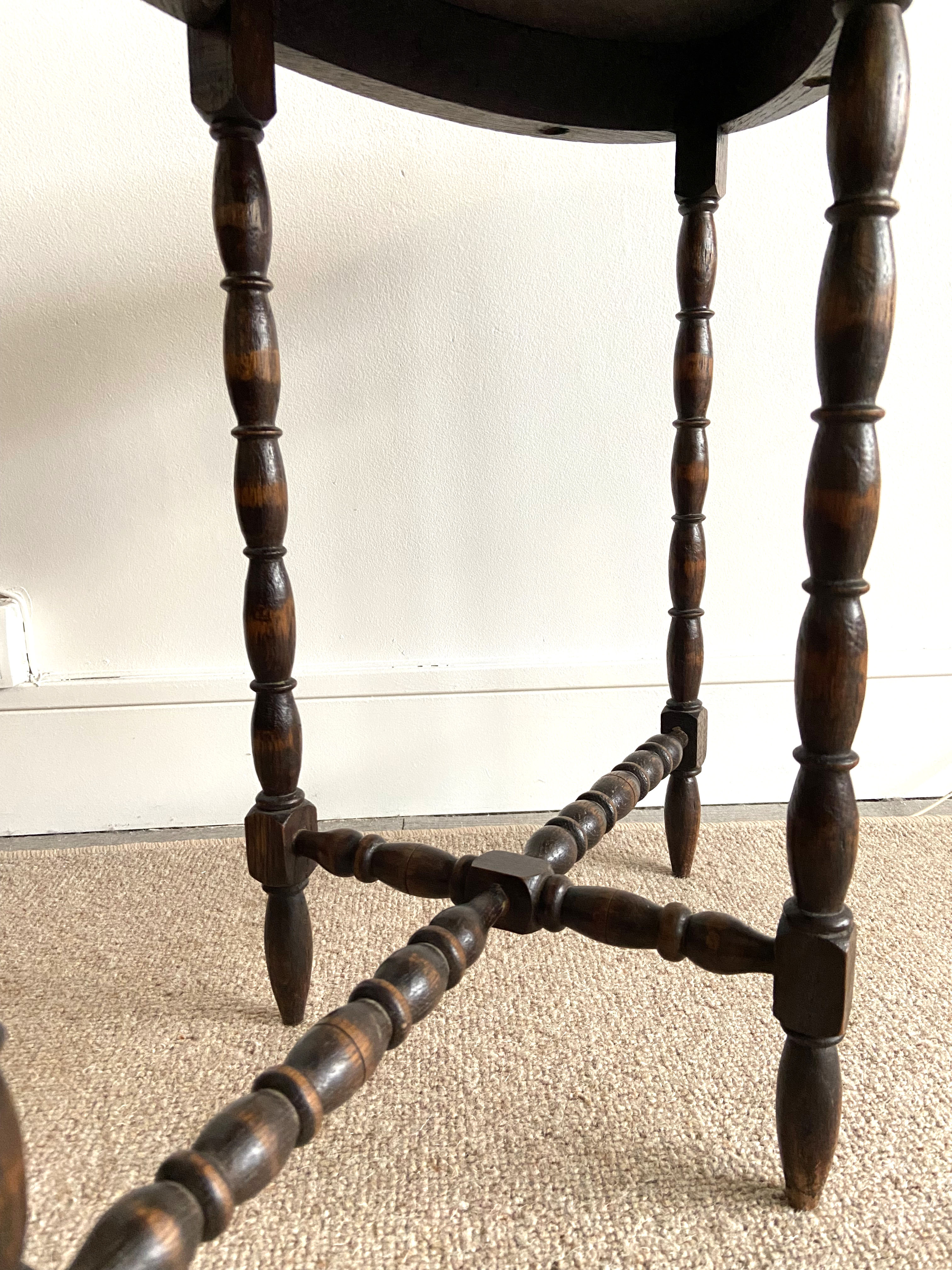 Oval wooden side table turned with spacer