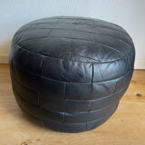Black patchwork leather pouf from Sède