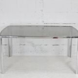 Living table. chrome metal, curved smoked glass slab, france, circa 1970.
