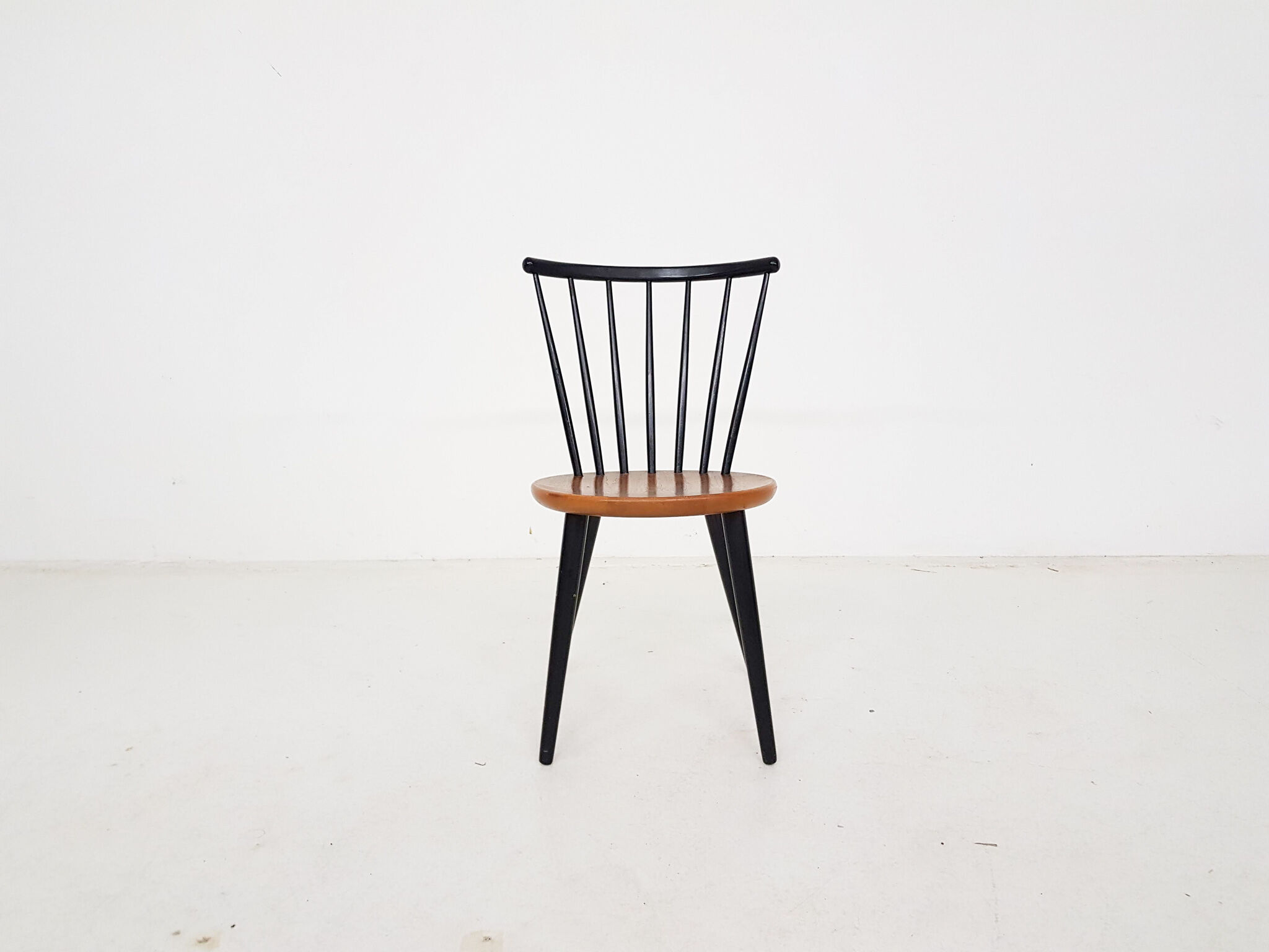 Vintage spindle back chair with round seating