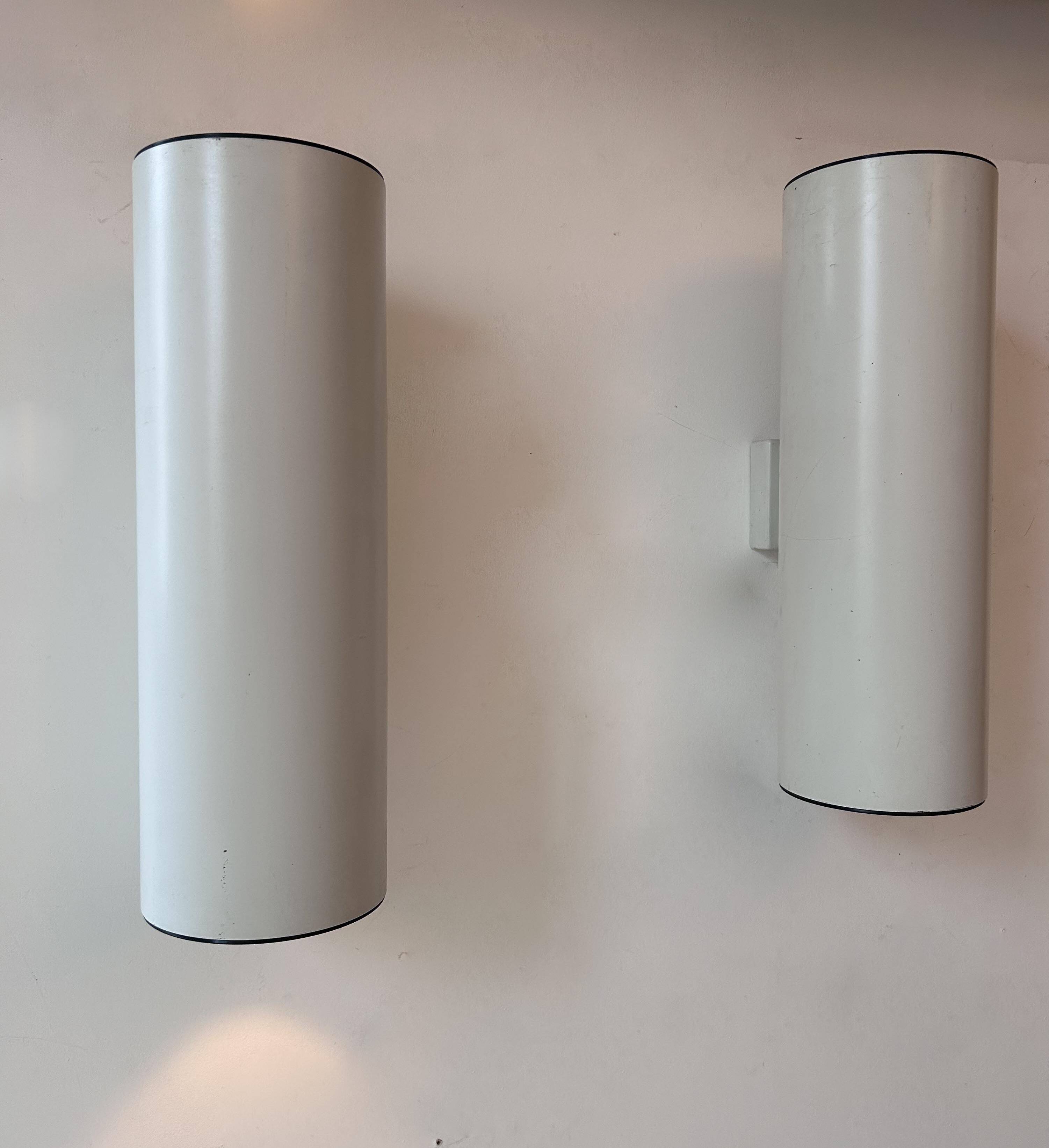 Pair of vintage cylindrical wall lights, matt white metal, Germany Erco 1976