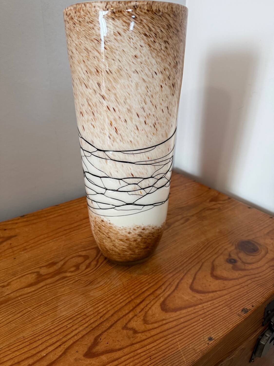 Large hand-blown glass vase in brown and beige.