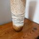 Large hand-blown glass vase in brown and beige.